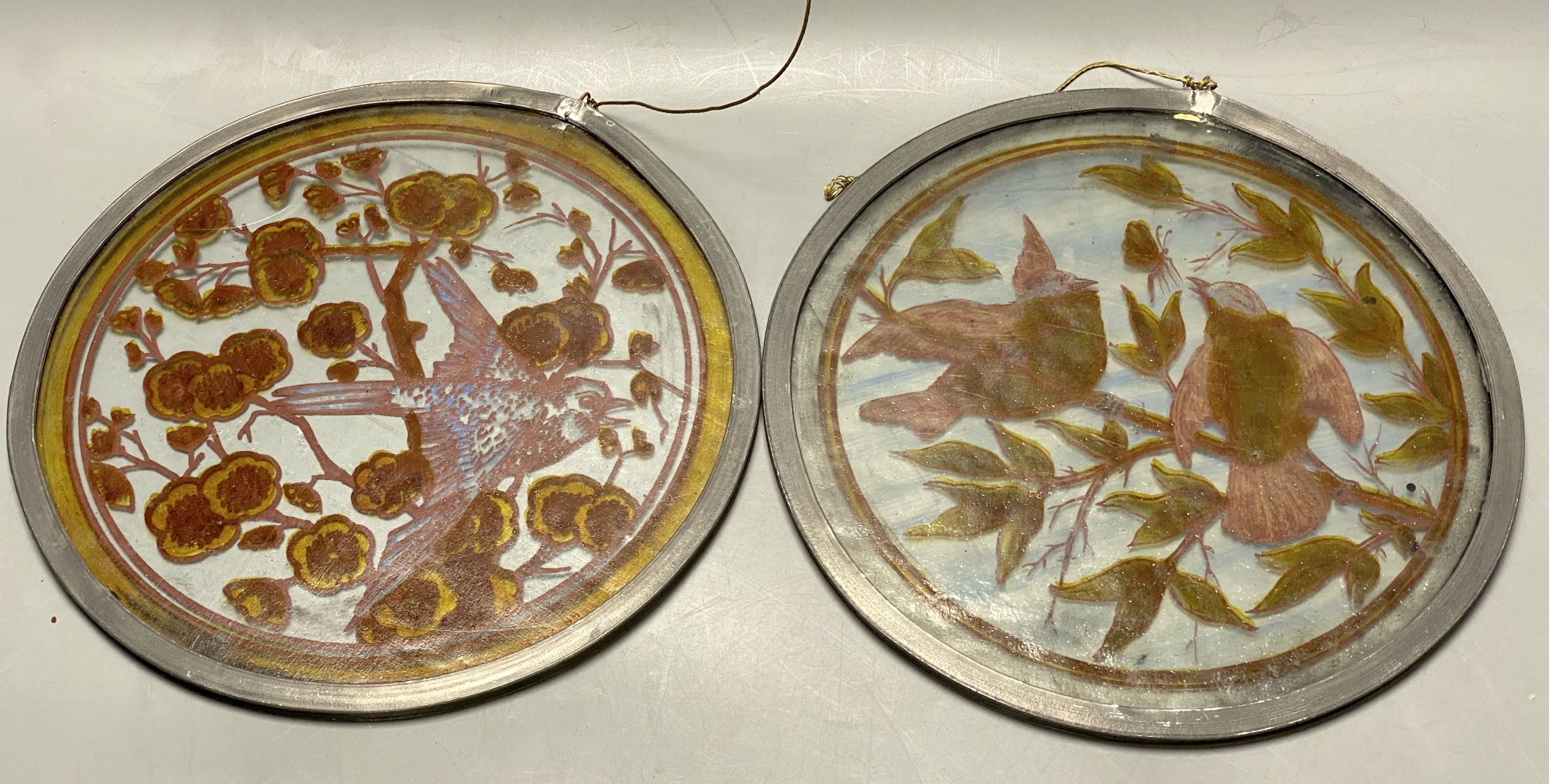 Two Victorian stained glass bird roundels